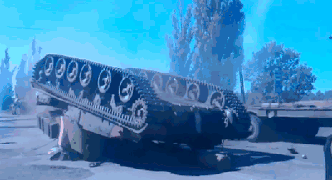 HERE'S A RUSSIAN TANK FALLING OFF A FLATBED TRUCK - THE SITREP MILITARY BLOG